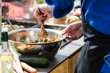 Chefs at work in a restaurant kitchen making delicious food