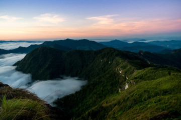 Fototapeta na wymiar sunrise and sea of fog view on phu chi fa mountain area and national forest park in chiang rai, Thailand.
