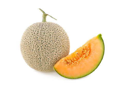 whole and cut piece ripe Japanese orange melon with stem on white background