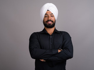 Young Indian Sikh businessman wearing white turban