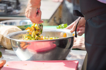 Chefs at work in a restaurant kitchen making delicious food