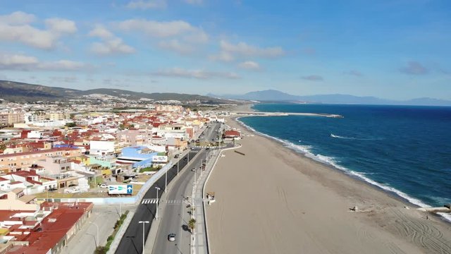 Gibraltar beach view from above, flying on the drone Spain. Beautiful beach and sea, mount Gibraltar and its surroundings in winter in December. Sea wave. Spanish slums on the shore