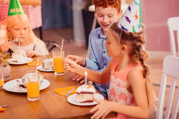 Positive delighted kids discussing taste of cake