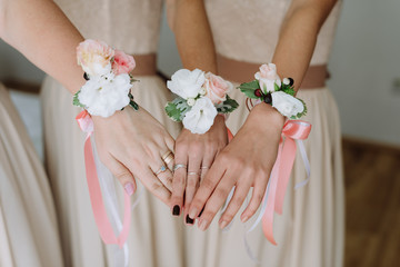 Obraz na płótnie Canvas bridesmaids demonstrate wedding bracelets