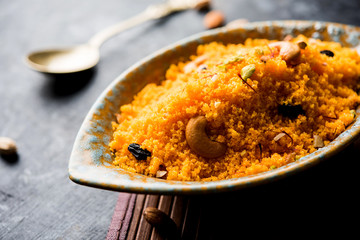 Badaam kesar shira / Sheera or almond saffron halwa, popular Indian dessert served in a bowl....