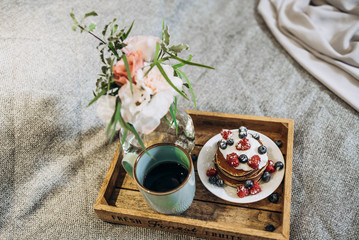 breakfast in bed to the bride. soft focus