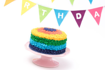 Birthday cake isolated on white background with happy birthday bunting