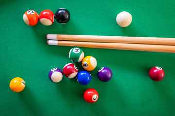 Snooker or Pool game on green table.