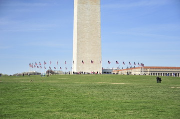 The base of the Washington Monument is surrounded by American flags