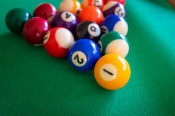 Snooker or Pool game on green table.