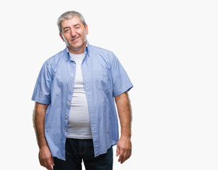 Handsome senior man over isolated background winking looking at the camera with sexy expression, cheerful and happy face.