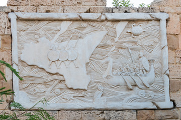 Yasmine Hammamet, TUNISIA - JULY 26 2018: The decorated wall with a battleship and the island of...