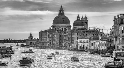 Italy beauty, traffic on Grand canal near to cathedral Santa Maria della Salute in Venice, Venezia