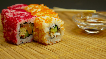 Sushi roll with soy sauce