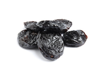 Heap of tasty prunes on white background. Dried fruit as healthy snack