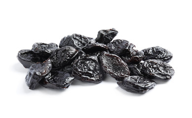 Heap of tasty prunes on white background. Dried fruit as healthy snack