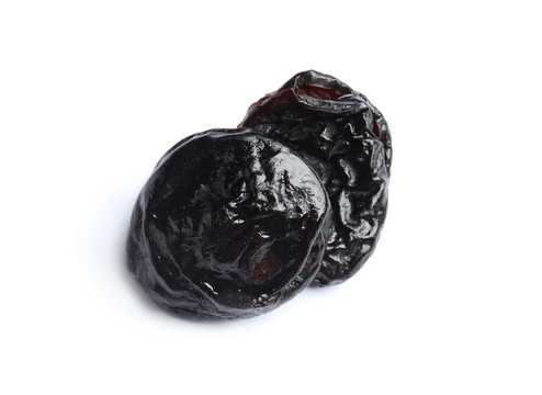 Tasty prunes on white background. Dried fruit as healthy snack