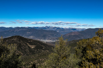 Fototapeta na wymiar Solid blue sky on a mountain range landscape 