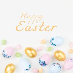 Festive Easter background with decorated eggs, flowers, candy and ribbons in pastel colors on white. Copy space