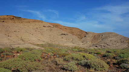 View from the basis of Montana Pelada, an arid volcanic cone formed of fossilized sand dunes, situated at one end of El Medano surf resort in south of Tenerife, Canary Islands, Spain