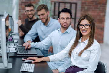 employees of the business center, sitting in the computer room