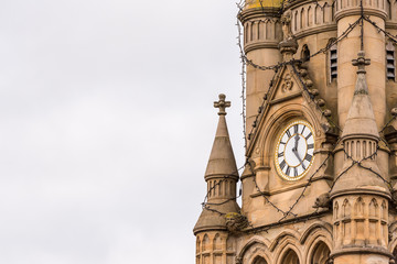 Fototapeta na wymiar cloudy day view gothic architecture details with clock in england