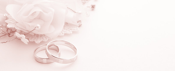 Wedding rings on wedding card on a white background, border design panoramic banner, toning color living coral - 244979522
