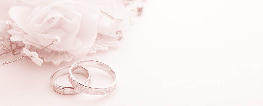 Wedding rings on wedding card on a white background, border design  panoramic banner, toning color living coral Photos | Adobe Stock