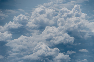Naklejka na ściany i meble Skyline View above the Clouds from air plane