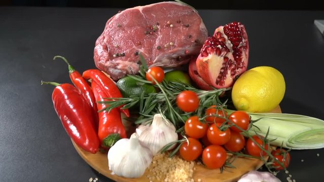 Meat with vegetables and fruits. slow motion
