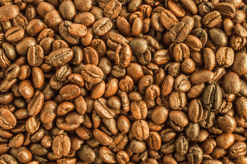 Roasted coffee beans closeup texture background