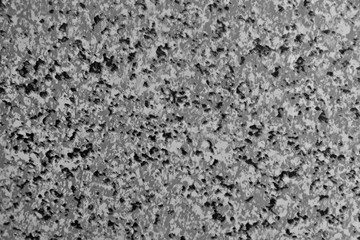Artificial vinyl texture with imitation marble. Background with black, gray and white crumbs. Patterns on the surface.
