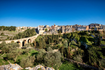 Obraz premium Gravina in Puglia, with the Roman two-level bridge that extends over the canyon. Bari, Apulia, Italy.