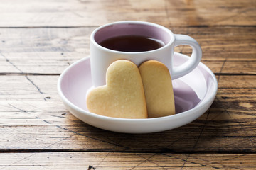Heart home cookies and cup of coffee on a plate. Concept Valentine's Day