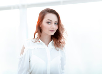 Portrait of a beautiful young business woman in bright office