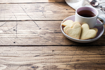 Heart home cookies and cup of coffee on a plate. Concept Valentine's Day