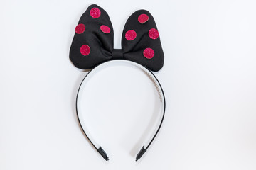 Hair band with black ribbon and red shiny dots isolated on white background.