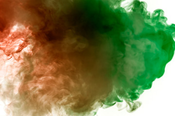 Multicolor, thick smoke, illuminated by colored in green and red light against a white isolated background, welded with clubs and curls, rising from a steam of vape. Wind blow