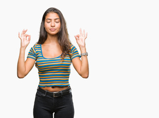 Obraz premium Young beautiful arab woman over isolated background relax and smiling with eyes closed doing meditation gesture with fingers. Yoga concept.