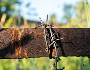 rusty barbed wire on a fence