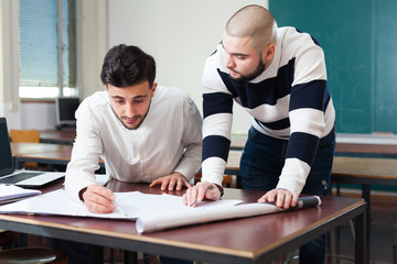 Naklejka premium Students preparing for exams in classroom