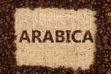 Arabica written with coffee beans.