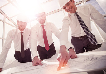 group of architects discussing sketches