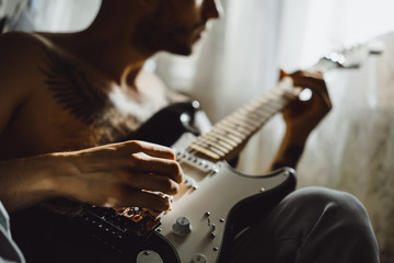 Young man playing the guitar