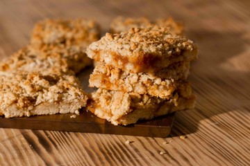 homemade apple pie on wooden background close up with copy space