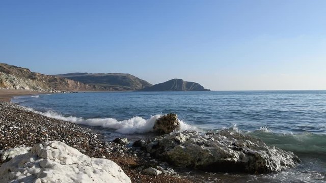 Waves on the beach at Worbarrow Bay on the Jurassic Coast in Dorset.