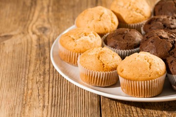 Chocolate cake and nut cake, homemade cakes on wooden background
