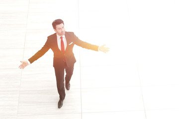 top view from afar.Businessman spreads his hands to the sides