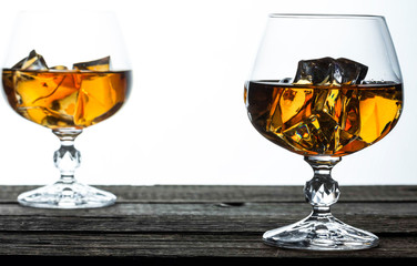 glasses for brandy close-up on an old wooden background