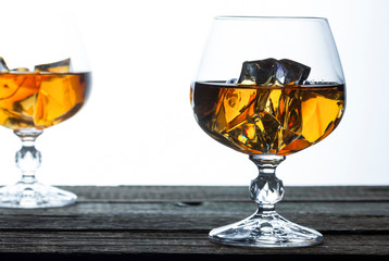 glasses for brandy close-up on an old wooden background